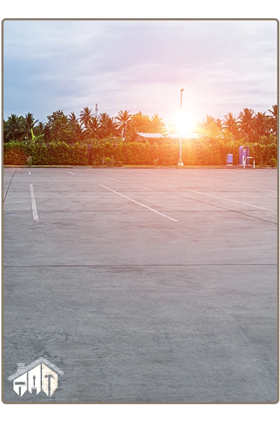beautifully finished empty parking lot under blue sky & clouds