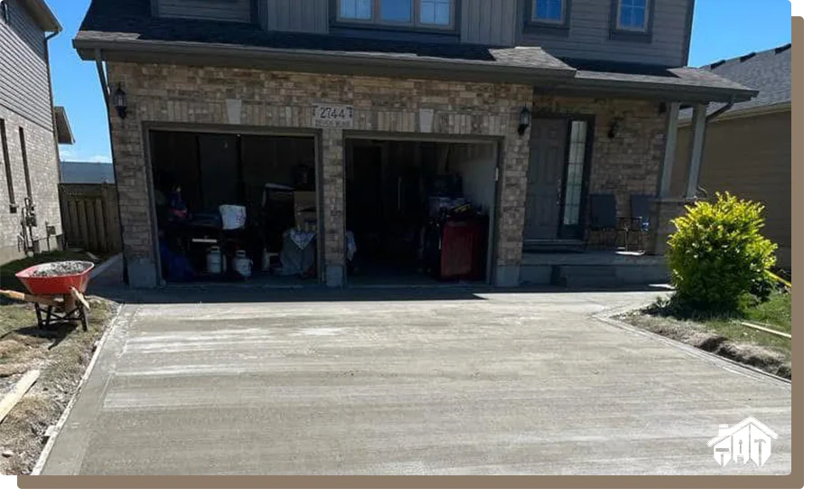 close up of new concrete driveway drying at residential site near london ontario