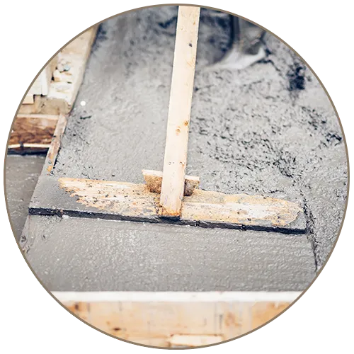 concrete worker laying concrete layer