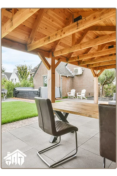 well designed concrete patio in back garden area with table & chairs